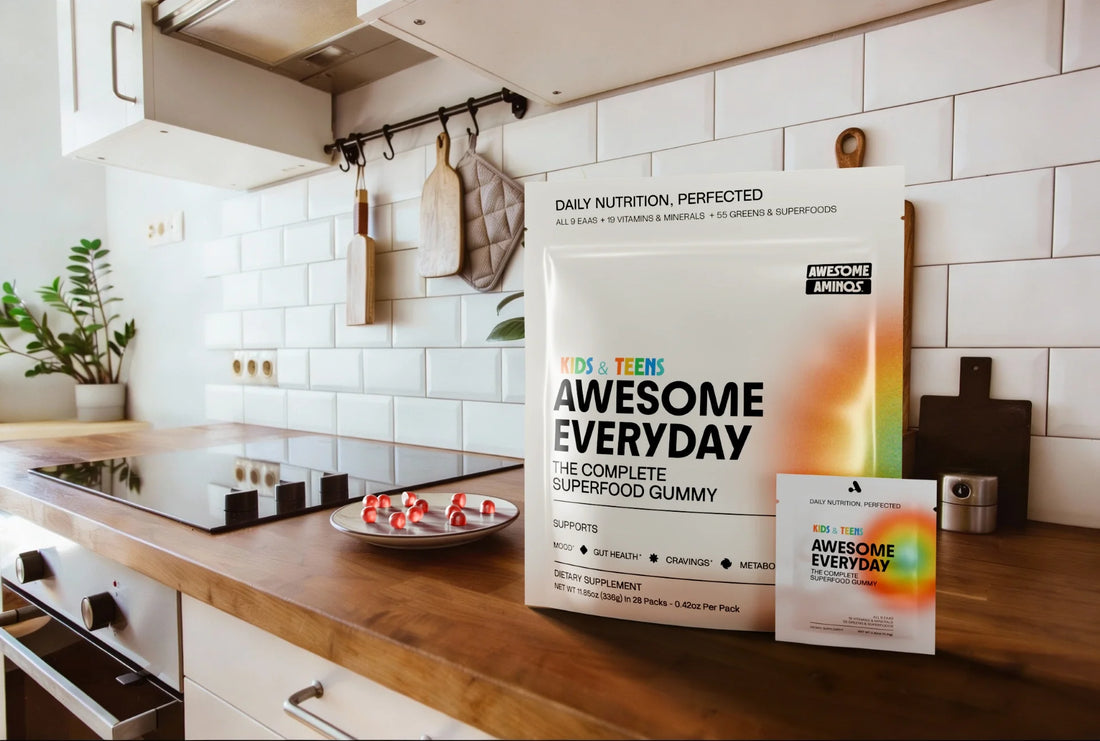 Awesome Everyday™ gummies and pouch displayed on a kitchen counter.