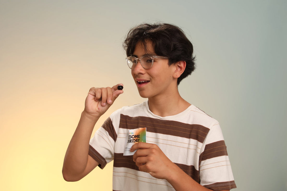  Awesome Everyday™ Kids & Teens pouch displayed with colorful gummies on a bright background.