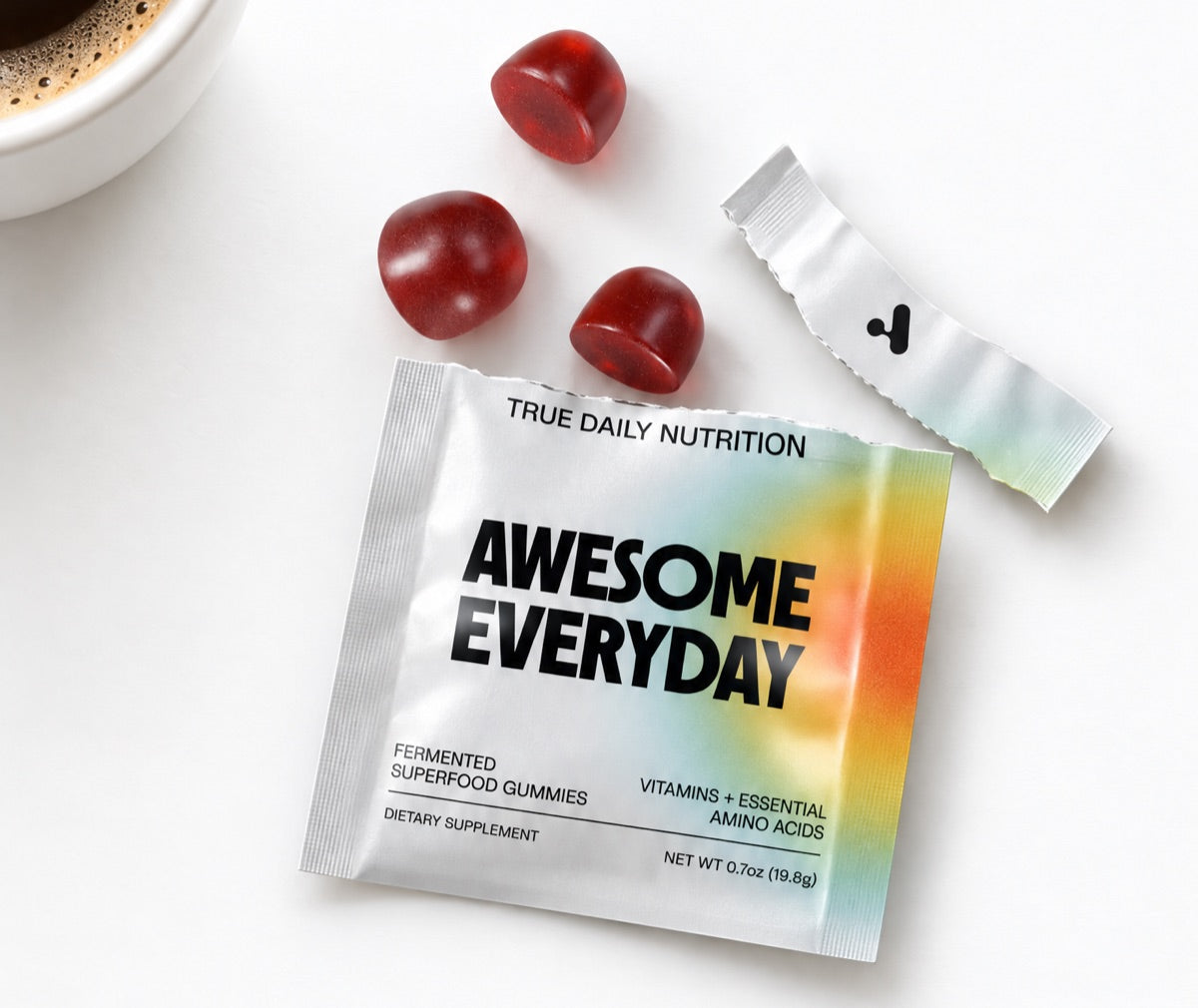 An open Awesome Everyday pack with three gummies beside it