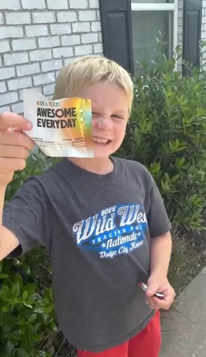 A boy showing off his pack
