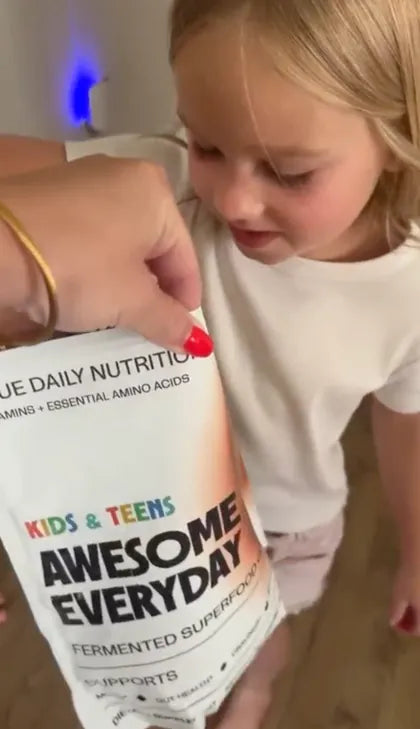 A child opening the Awesome Everyday pouch
