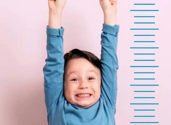 A child cheering beside a growth chart